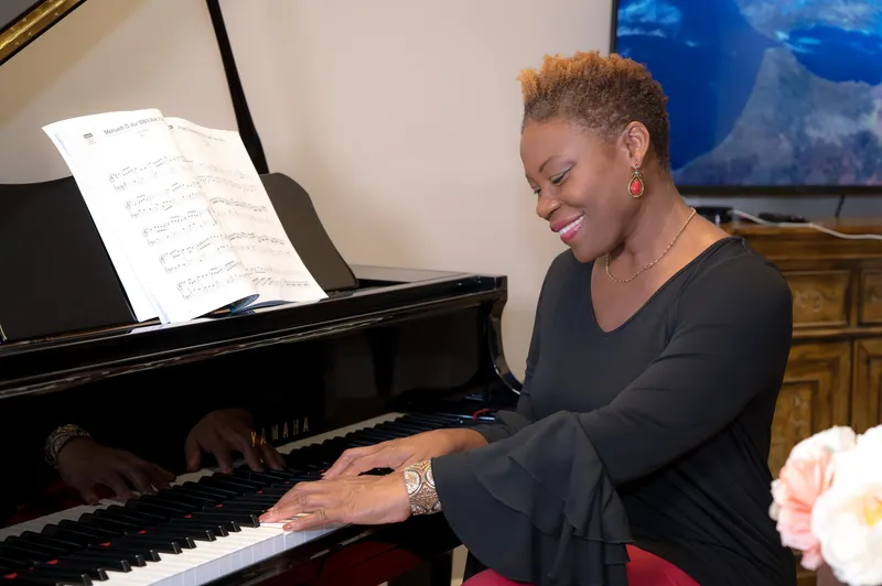 Music teacher Vivia Taylor plays piano.