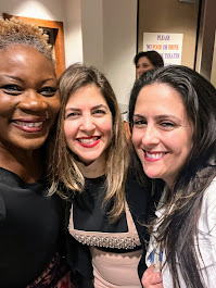 Music teacher Vivia Taylor and two women smiling.