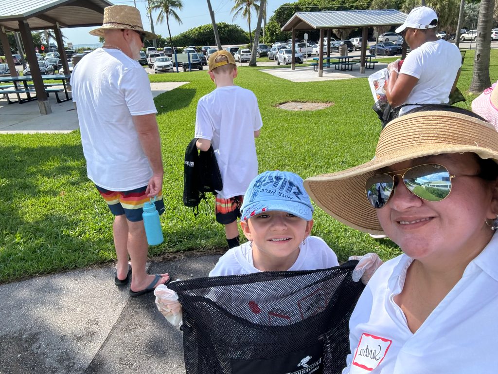 Music students and family members at a beach cleanup.