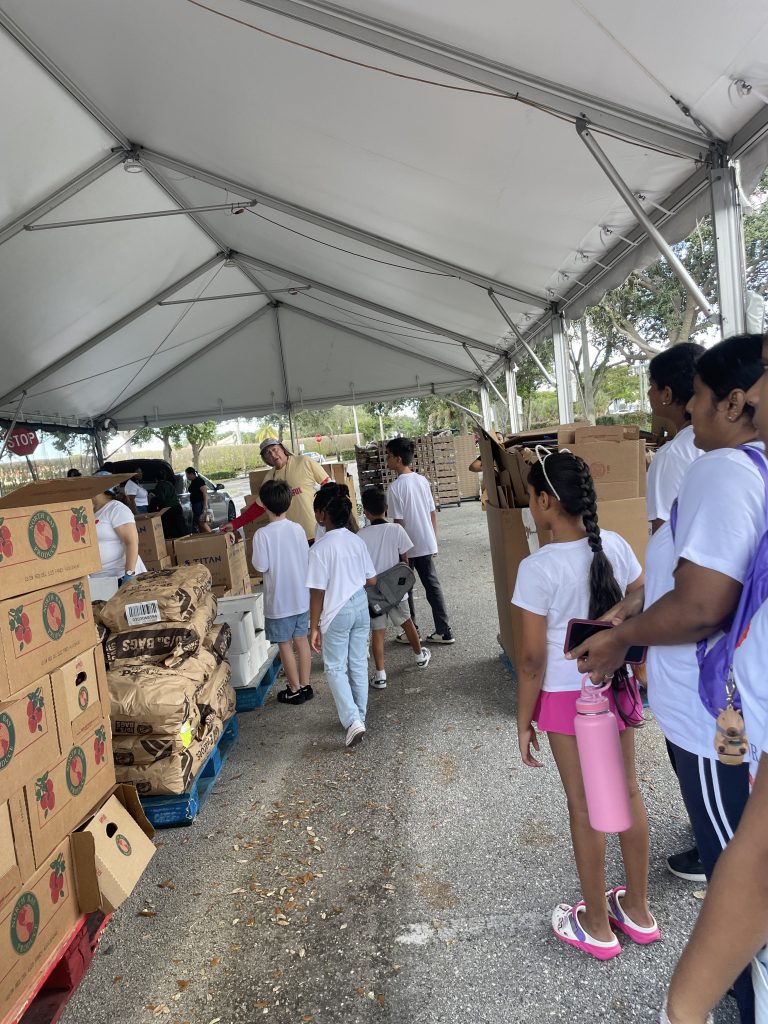 Music students and family members volunteering for Feed the Hungry.